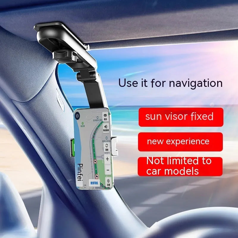 A black and grey car phone holder bracket clipped onto a vehicle air vent.