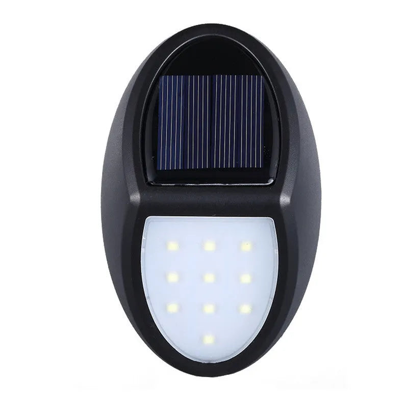 Black rectangular LED solar wall light mounted on an outdoor surface