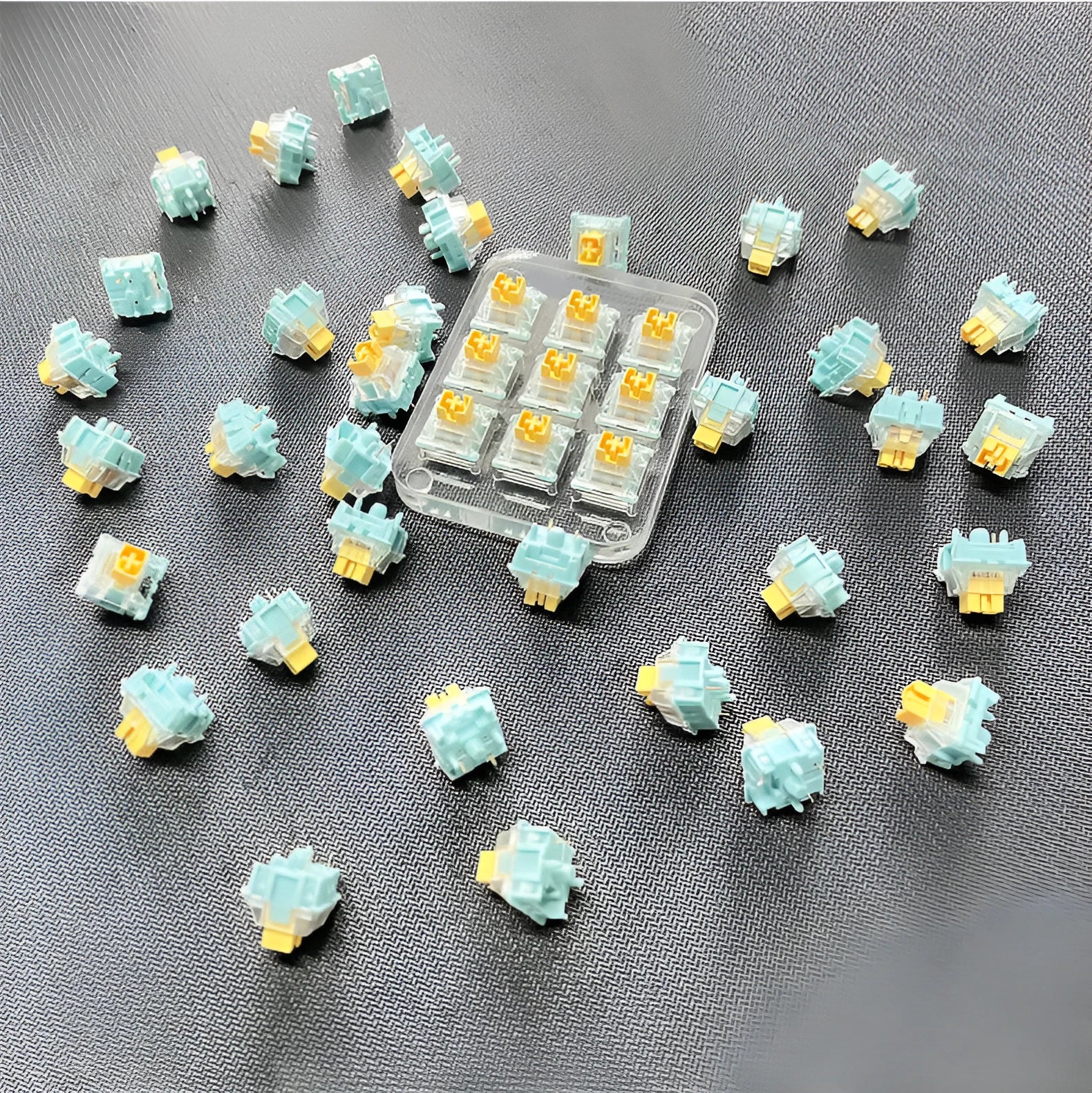 Pack of 36 Sea Salt Lemon PRO Mute tactile keyboard switch bodies for mechanical keyboard modding.