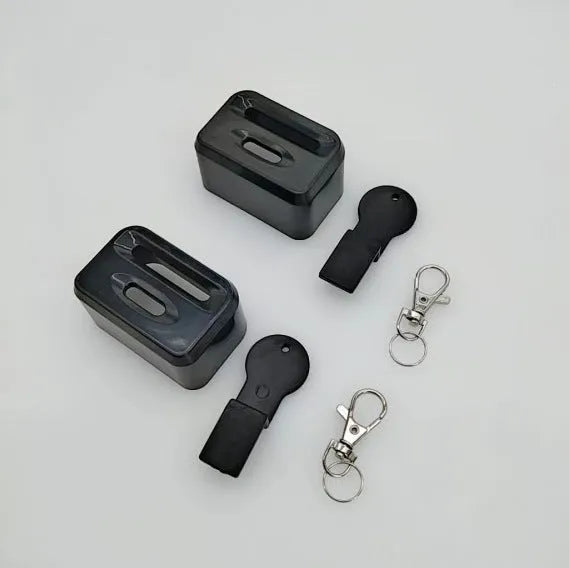 Black plastic seat belt lock catch protective device installed on automotive seat belt buckle