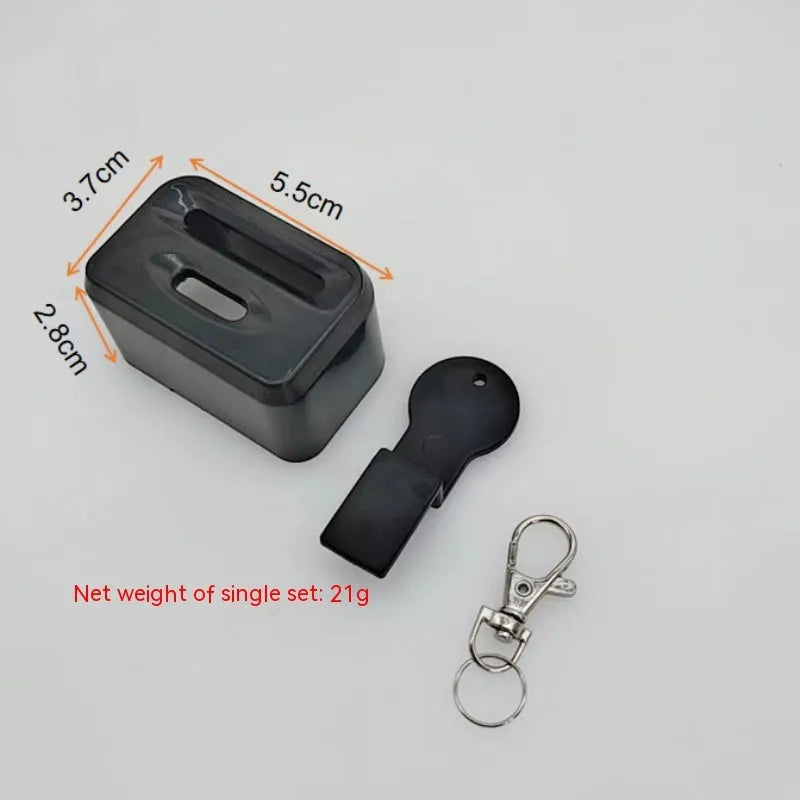 Black plastic seat belt lock catch protective device installed on automotive seat belt buckle