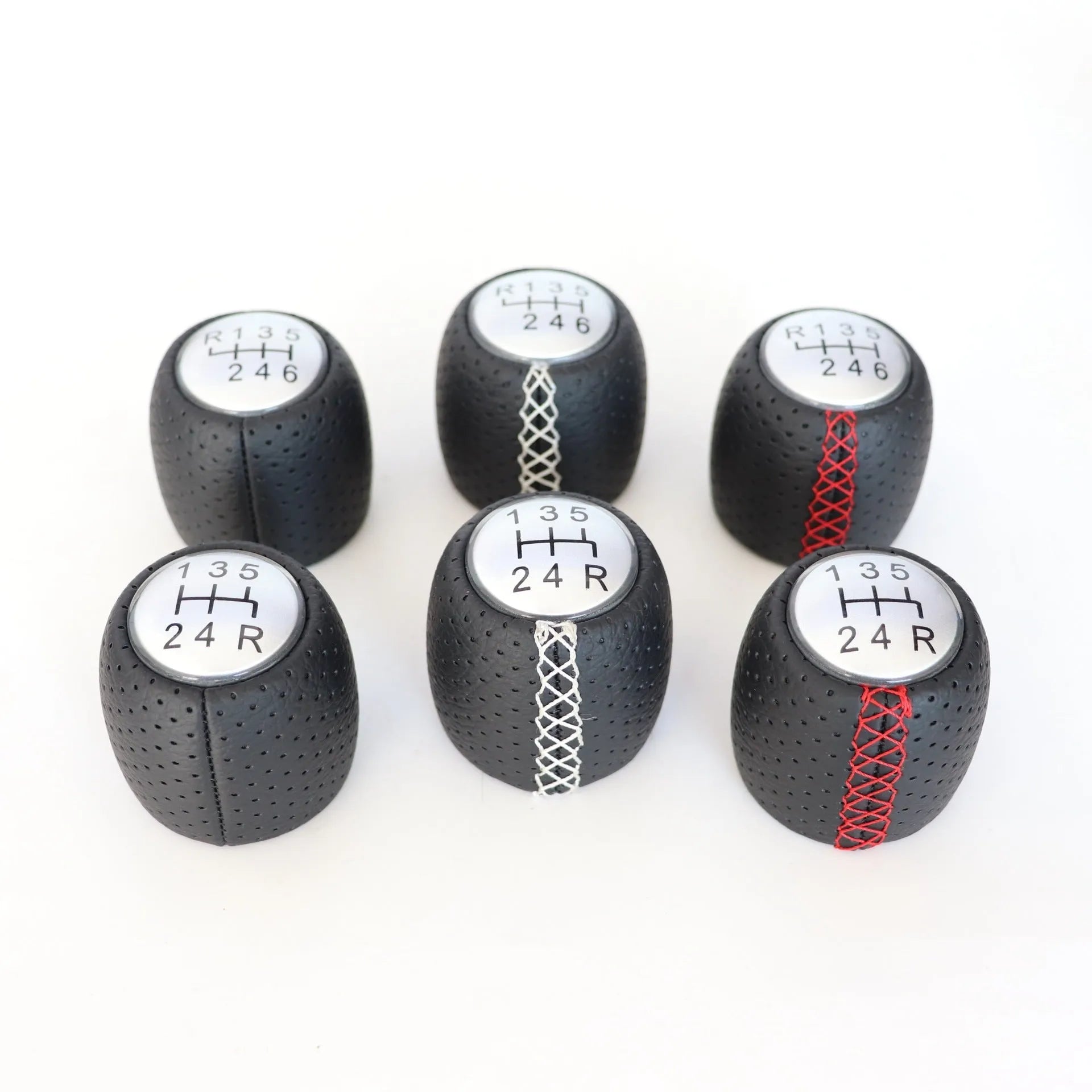 Sewn wrapped leather perforated style handball gear for Alpha vehicles in black, red, and white line options
