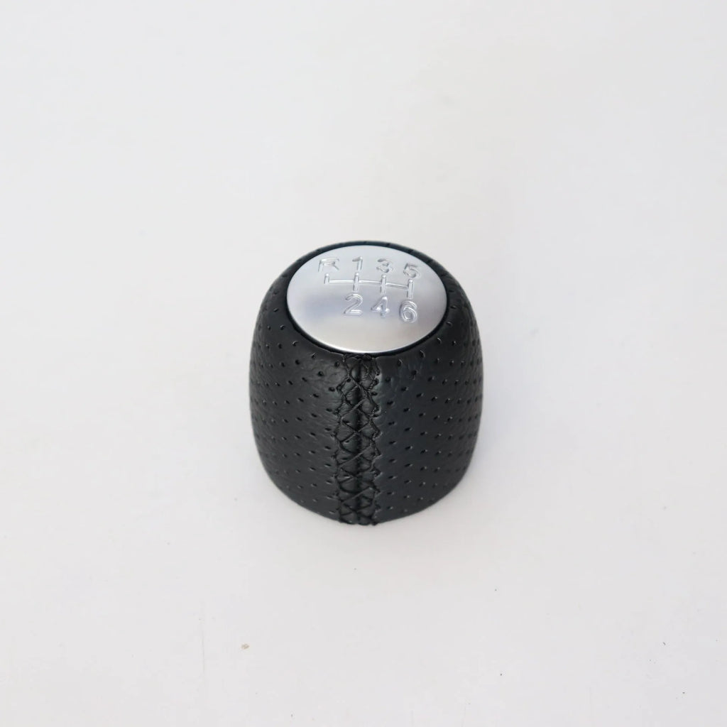 Sewn wrapped leather perforated style handball gear for Alpha vehicles in black, red, and white line options