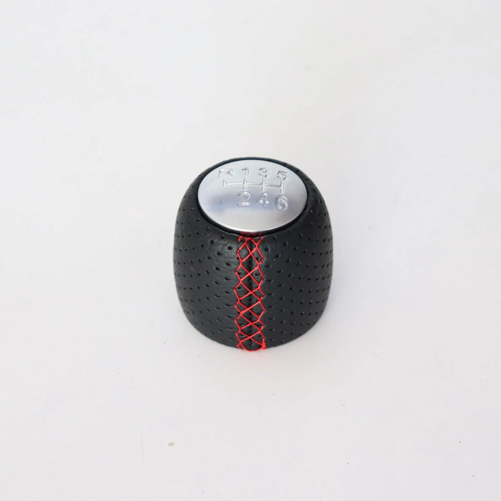 Sewn wrapped leather perforated style handball gear for Alpha vehicles in black, red, and white line options