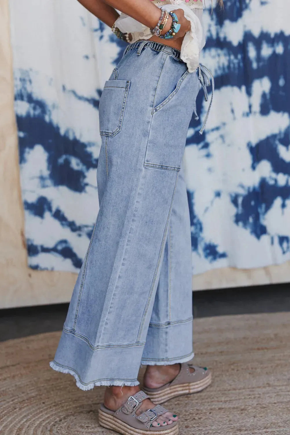 Beau Blue women's wide leg denim trousers with drawstring waist and raw hem detailing