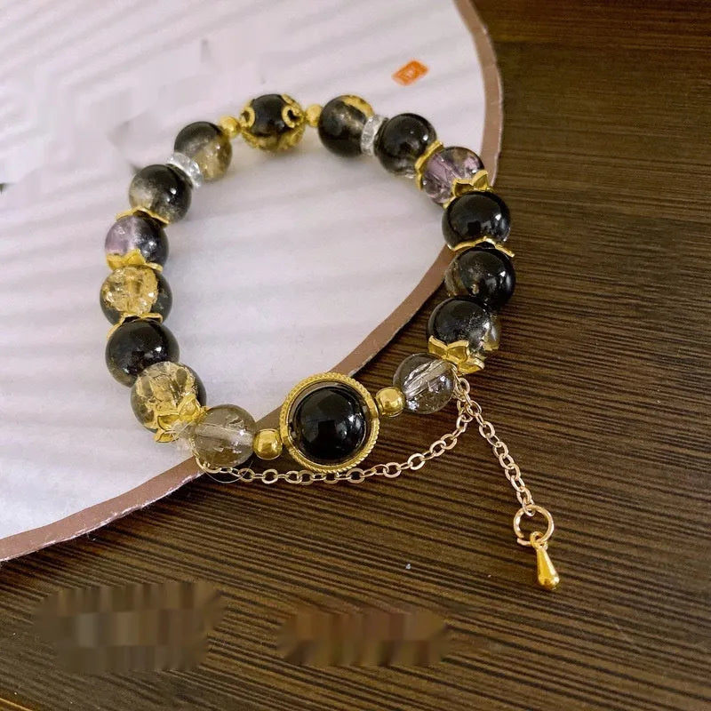 Chinese style glass bead bracelet with bamboo leaf design and manual craftsmanship details.