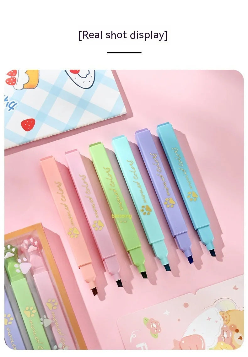 Cat's Paw fluorescent marker pen set with six colours in a plastic case, showing oblique nibs.