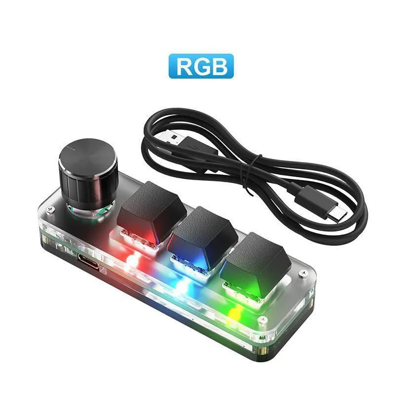 Black and white RGB backlit keypad keyboard with USB cable on desk