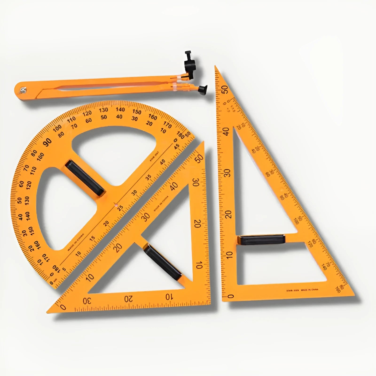 Orange and black plastic mathematics set with triangle rulers, protractor and chalk compass