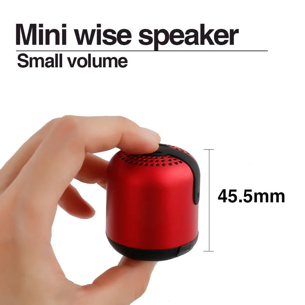 Hieha XQ11 cylinder-shaped portable Bluetooth speaker in silver colour on a table.