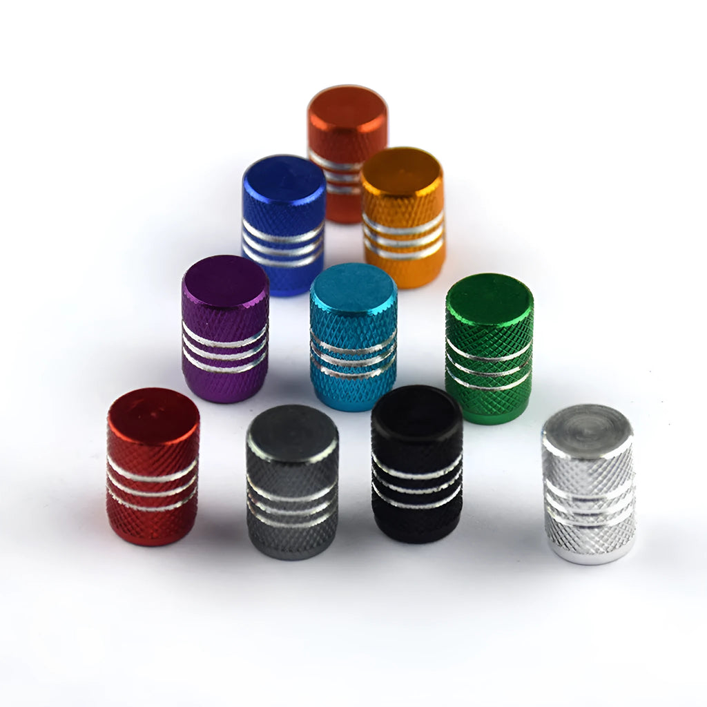 Set of aluminium alloy car tyre valve caps in multiple metallic colours showing stainless steel construction