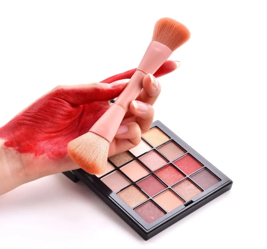 10-piece cosmetic brush set with pink wooden handles and nylon bristles arranged with makeup
