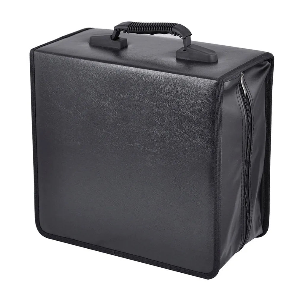 Black Oxford fabric CD DVD storage binder with zipper and top hand strap open to show disc sleeves.