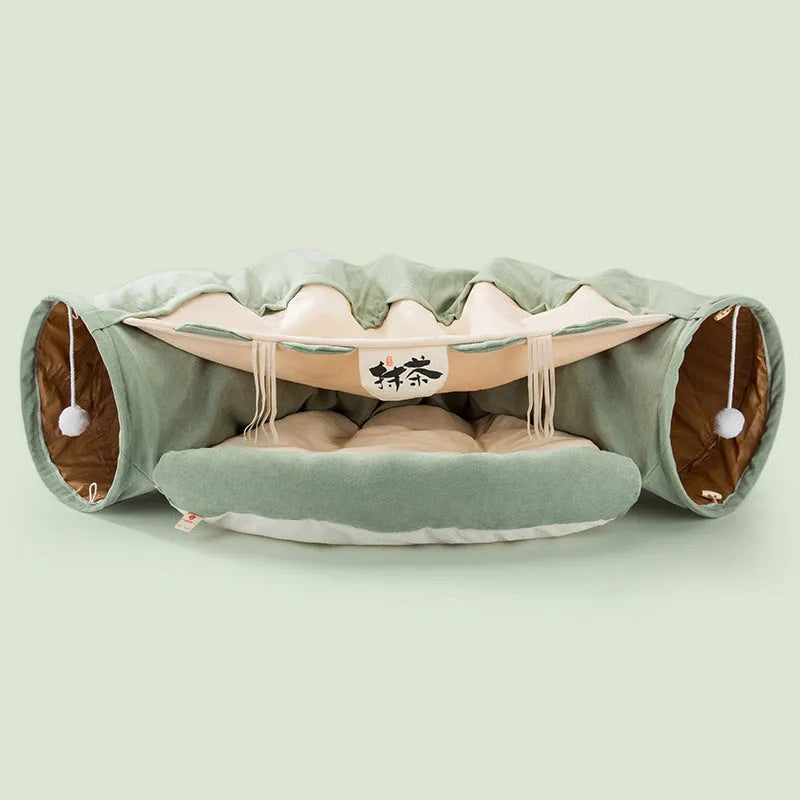 Dismantling and washing pet litter cat tunnel in green cloth with a cat inside
