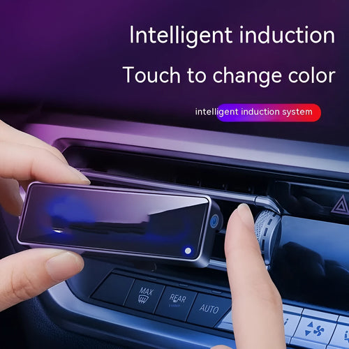 Black automobile air vent clip with LED light and aromatherapy diffuser for car odour removal.