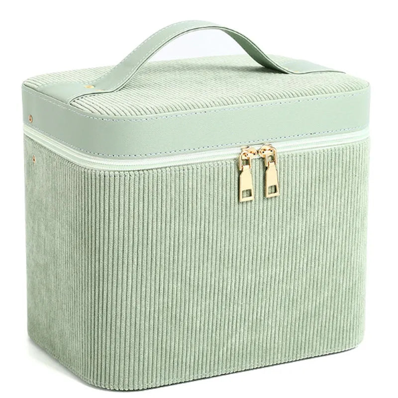 Corduroy cosmetic storage box in a solid colour with a lined interior.