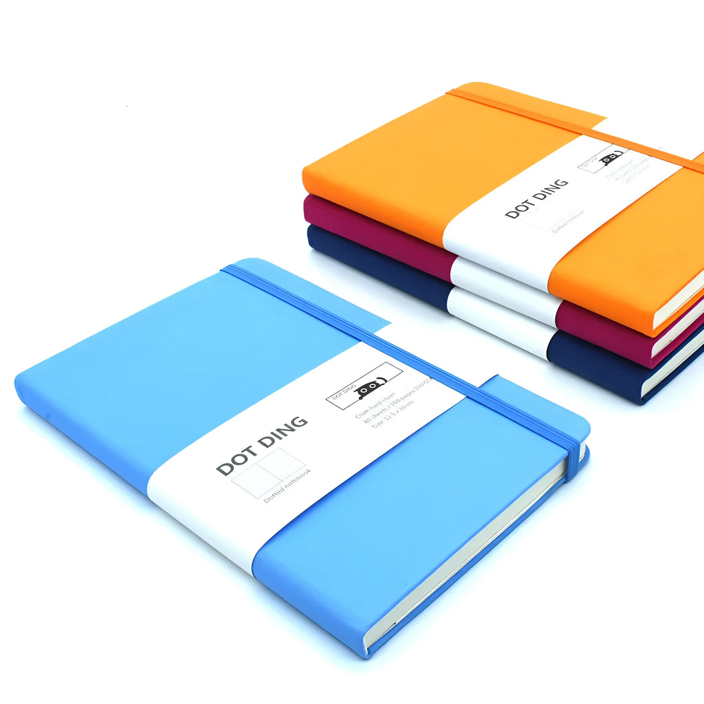 A5 dot grid bullet journal with fabric hard cover in blue, showing open pages with dot grid spread