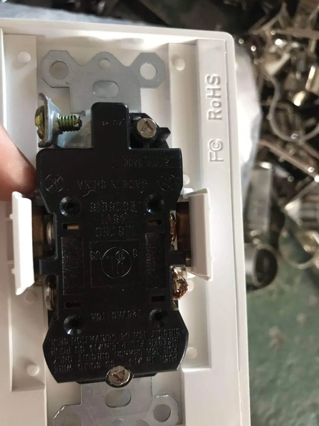 White LED socket induction night light installed in electrical outlet with automatic sensor