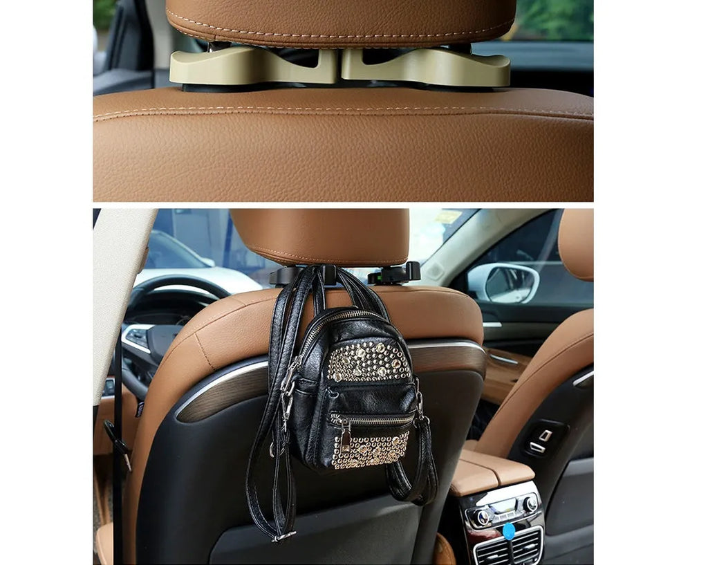 Pair of black plastic concealed car seat back hooks on a car seat back holding a bag