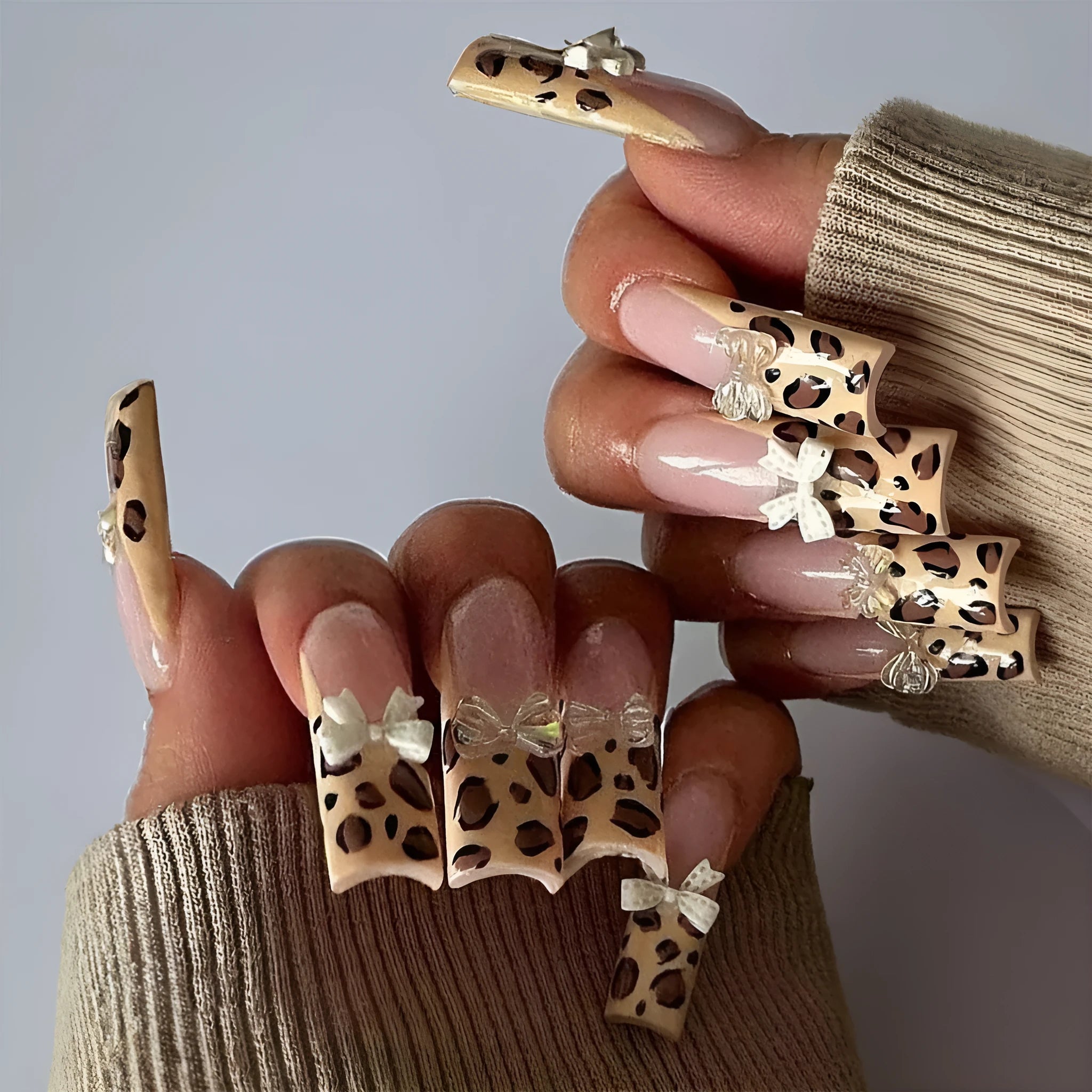 Leopard print false nails with butterfly wing designs, 24 piece plastic nail art set in WM296 colour
