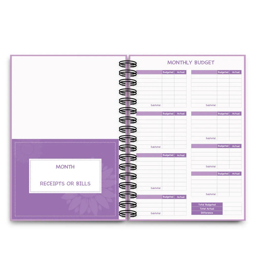 Purple coil-bound financial planning notebook with pen, stickers and paper clips for monthly budgeting