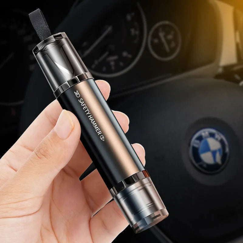 Black and red aluminium alloy car emergency hammer with a tungsten steel tip and a hidden seat belt cutter, shown with a mounting bracket.