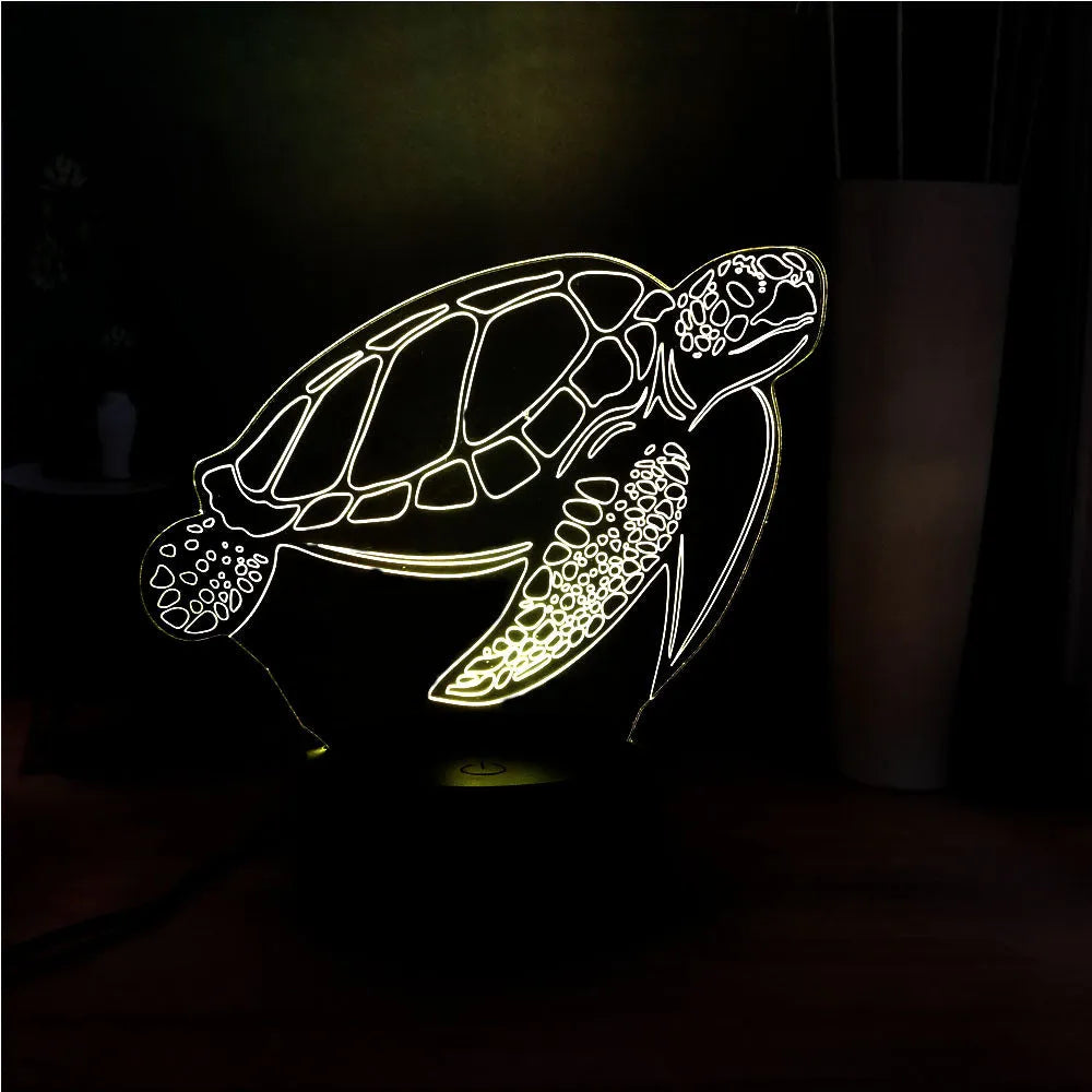 3D green turtle shaped LED night light on a table, showing multi-colour glow from its acrylic shell.