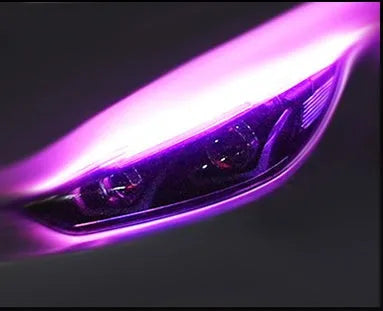Car LED daytime running light strip with flowing turn signal effect in blue to yellow colour.
