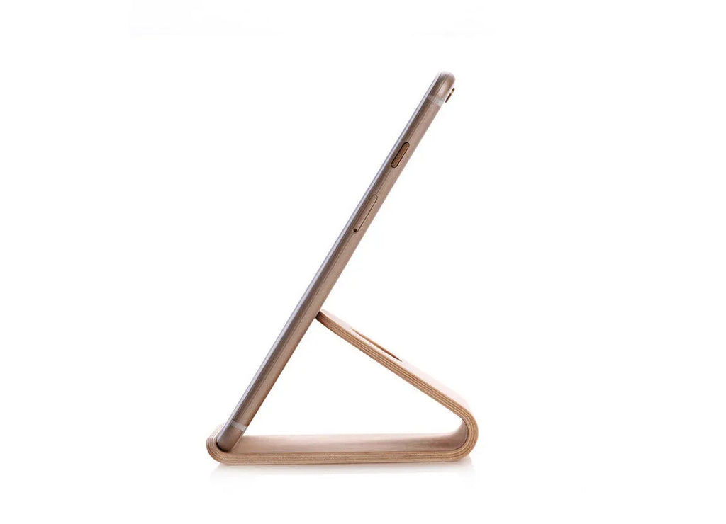 Minimalist wooden iPhone stand in walnut or white maple finish with a cable notch.