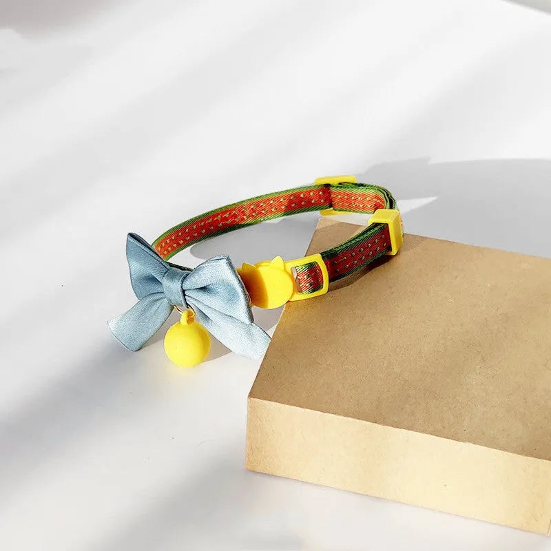 Cute cat bow tie collar with bell in eight colours – orange, pink, purple, navy blue, powder blue, yellow, green – adjustable size