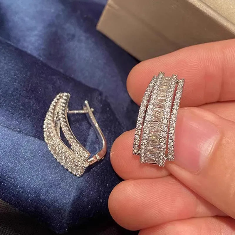 Geometric stud earrings with white gold colour finish and inlaid zircon stones