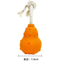 Natural rubber stuffable dog toy with a long strap for fetch and treat dispensing.