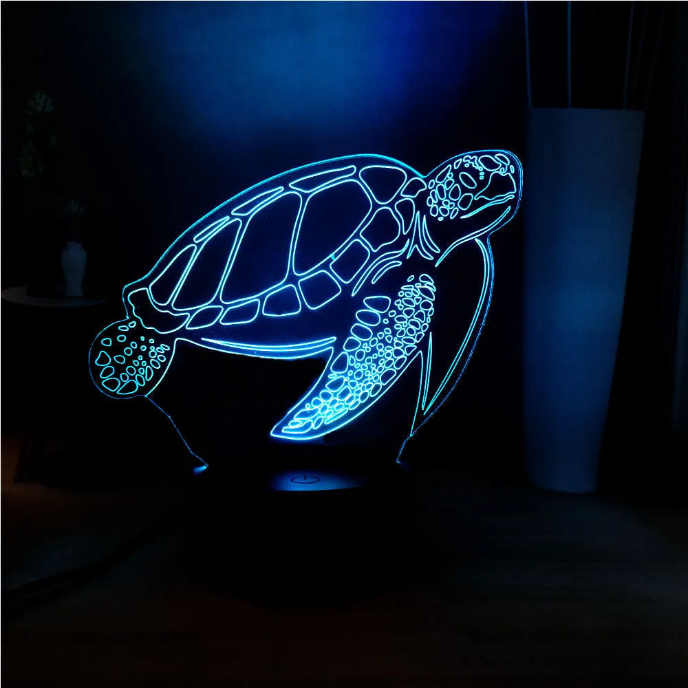 3D green turtle shaped LED night light on a table, showing multi-colour glow from its acrylic shell.