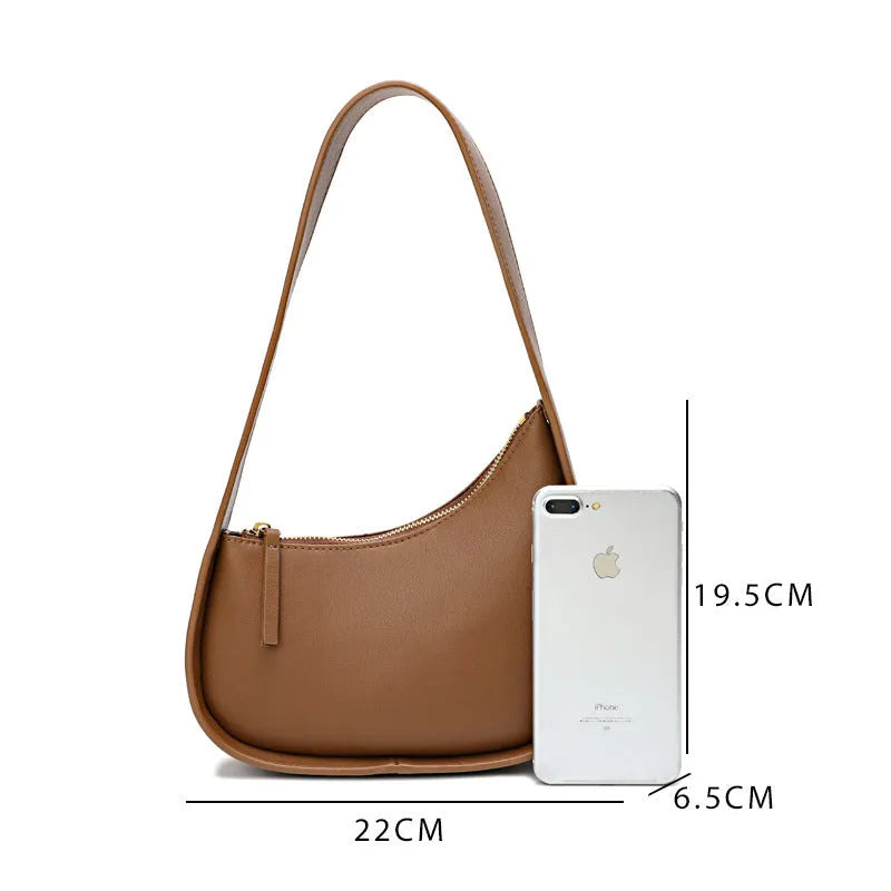 Genuine cowhide leather ladies handbag in half moon shape with wide shoulder strap