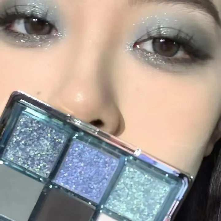 MUGELEEN nine-colour eye shadow palette showing blue smoked colours with matte and shimmer finishes
