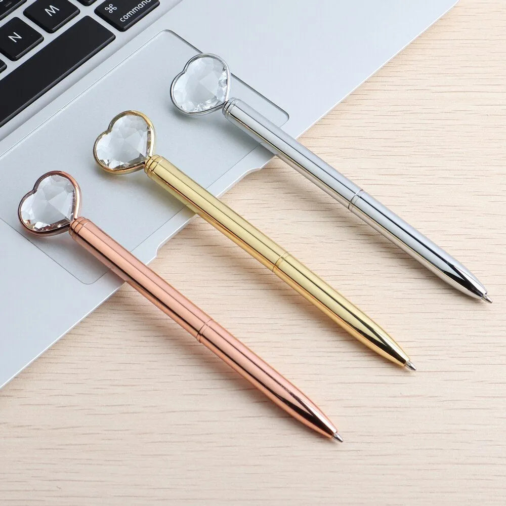 Creative Crystal Love Ball diamond metal pen in rose gold on a white background
