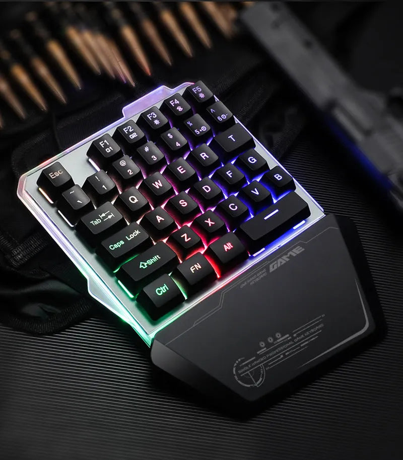 Black G40 Flow one-handed mechanical gaming keyboard with RGB backlit keys on a desk.
