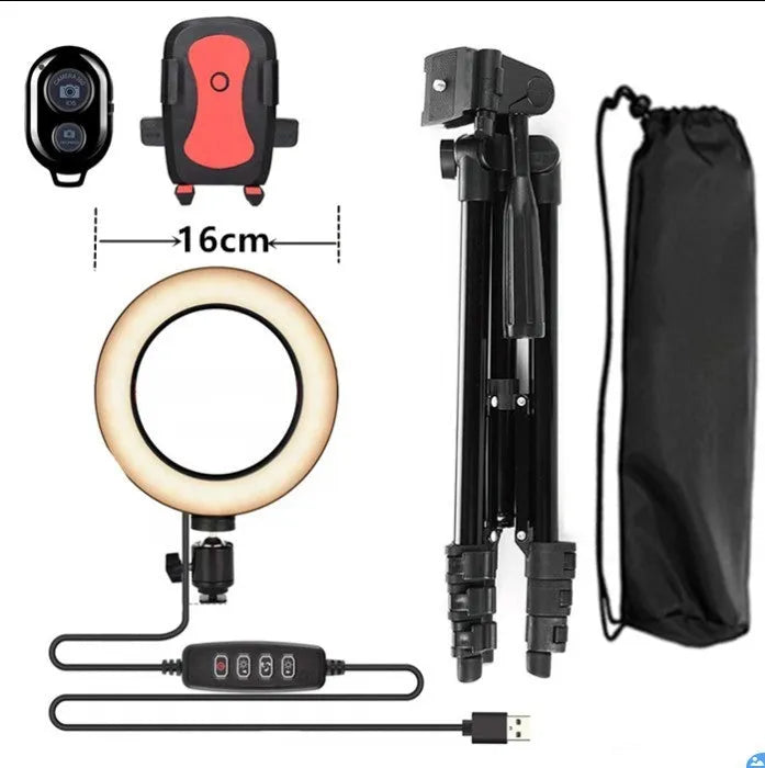 Silver adjustable tripod phone stand extended to mid-height with a ring light attachment point.