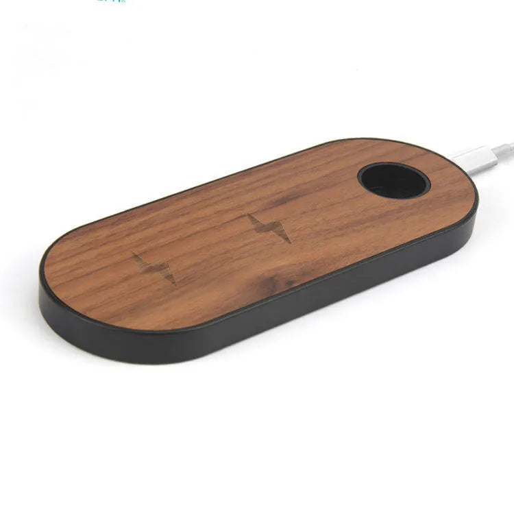 Bamboo wireless charging pad with beech wood trim on a desk