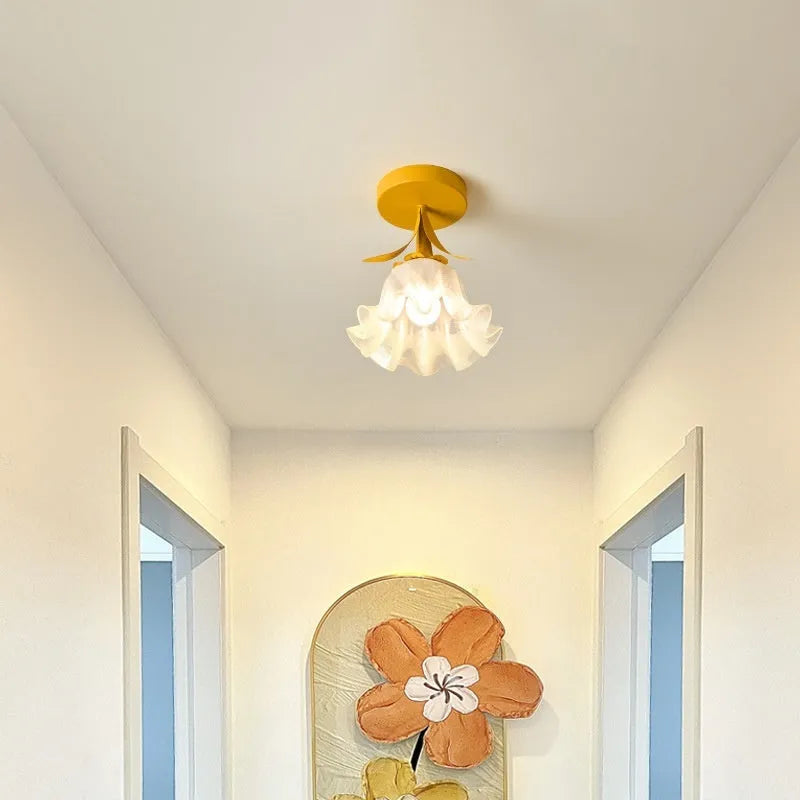 Cream coloured modern LED corridor wall light with remote control for three-colour changing and dimming.