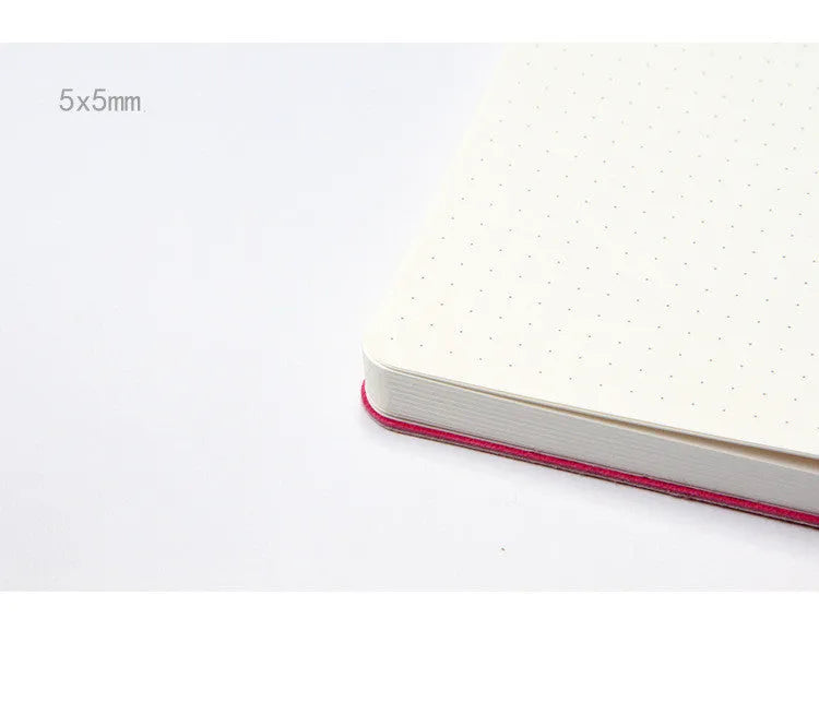 A5 dotted notebook with imitation leather cover in blue or pink colour options showing dot matrix interior pages