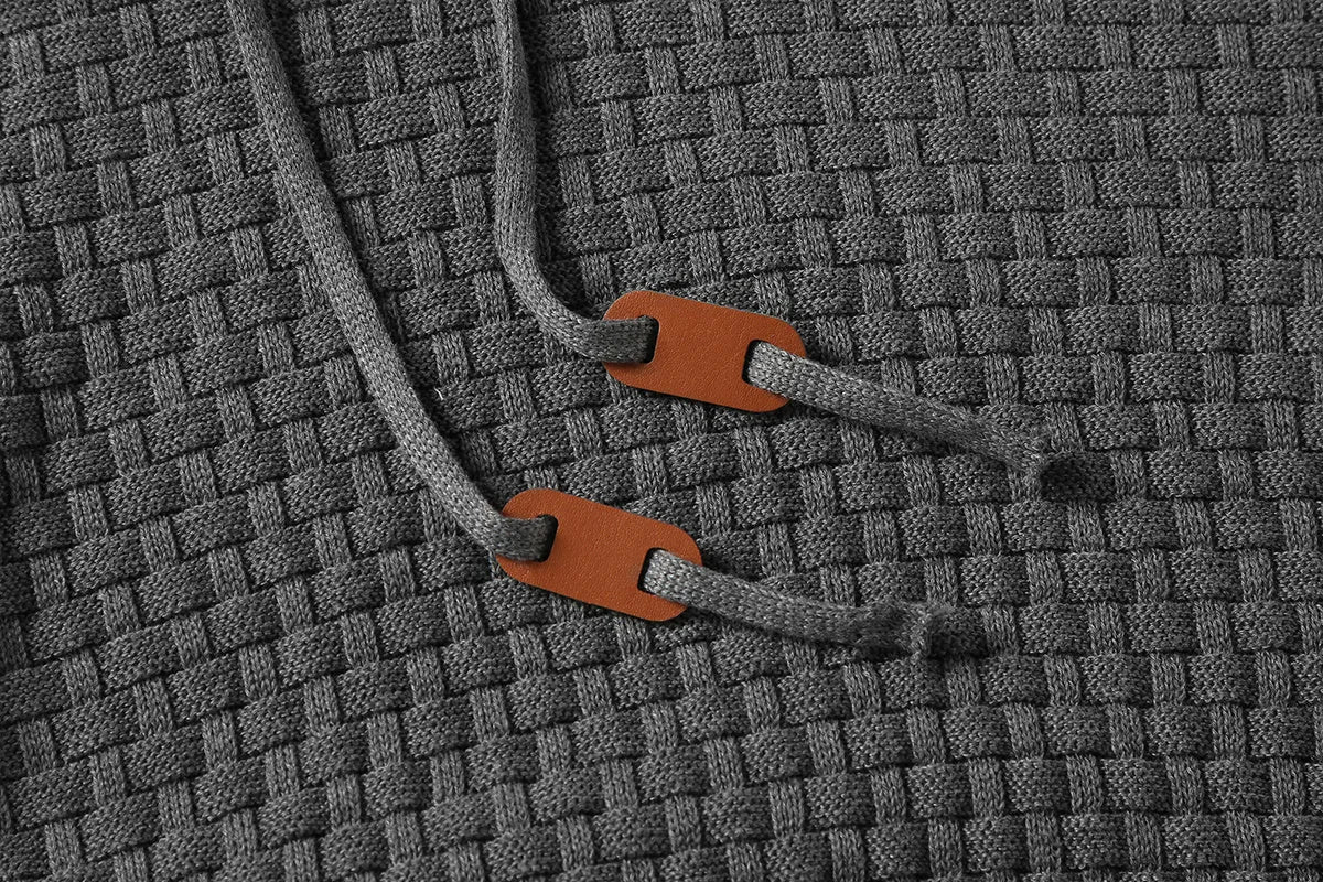 Men's grey cotton-polyester blend hooded sweatshirt on a hanger, showing front design and hood.