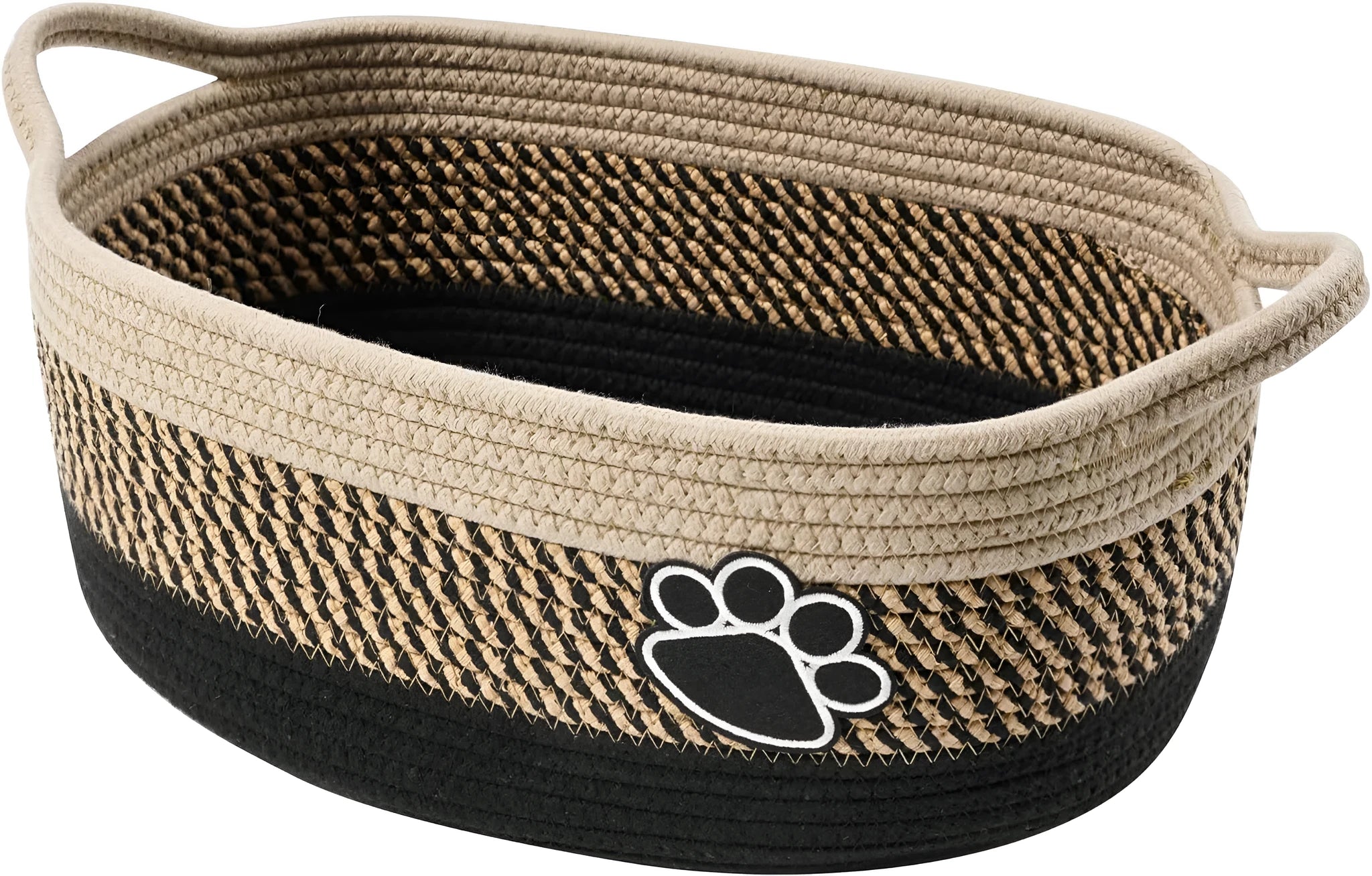 Handmade light beige woven cotton rope storage basket with a handle, shown on a wooden surface.