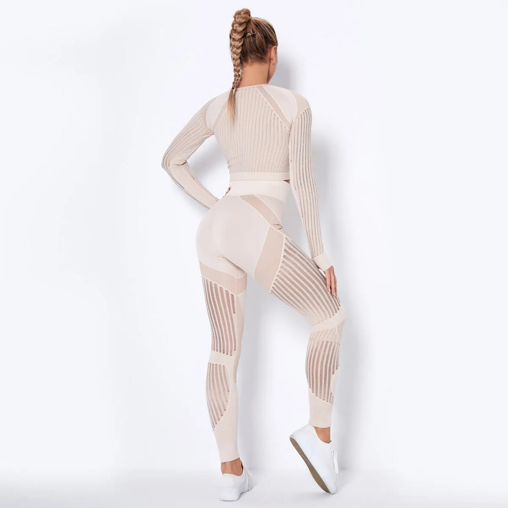Woman wearing a seamless long-sleeved striped yoga suit in a stretch pose.