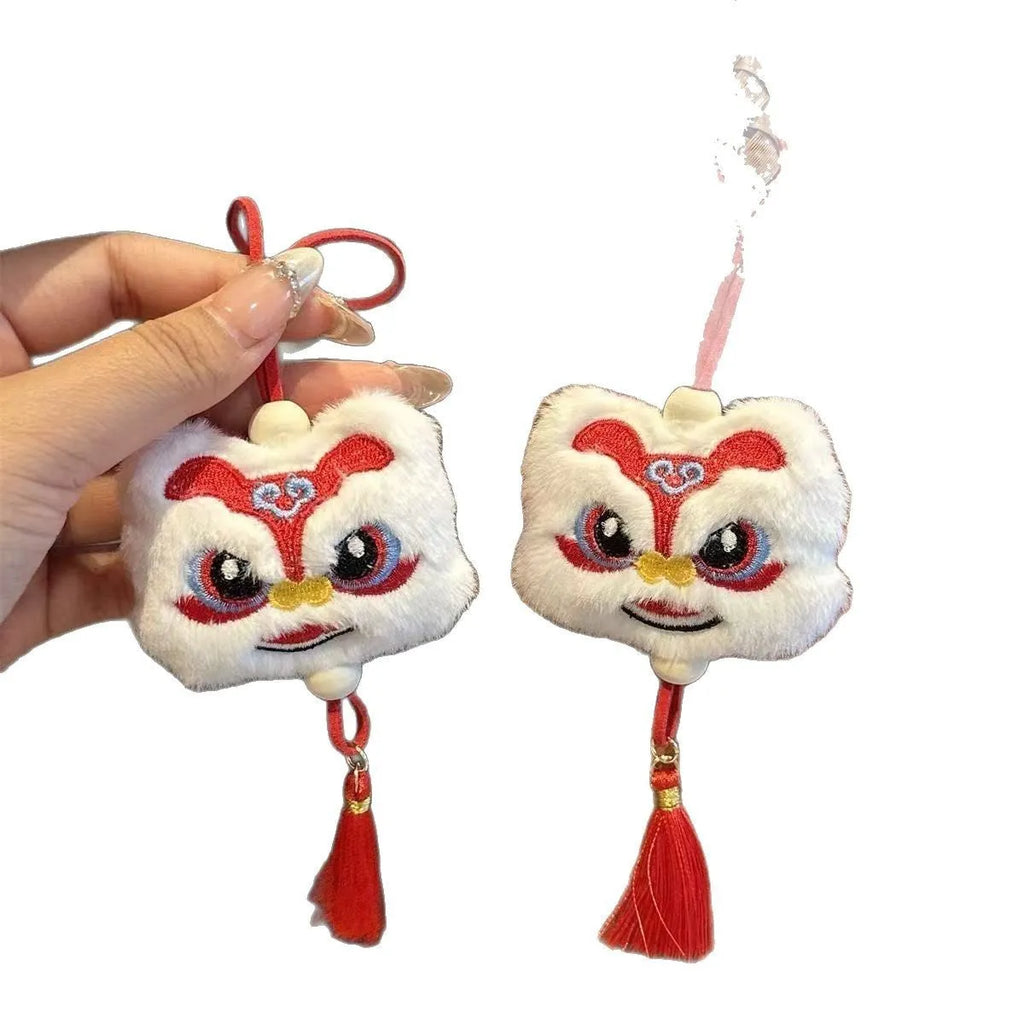 Chinese style plush lion keychain ornament with tassel and star stone accents in blue or yellow
