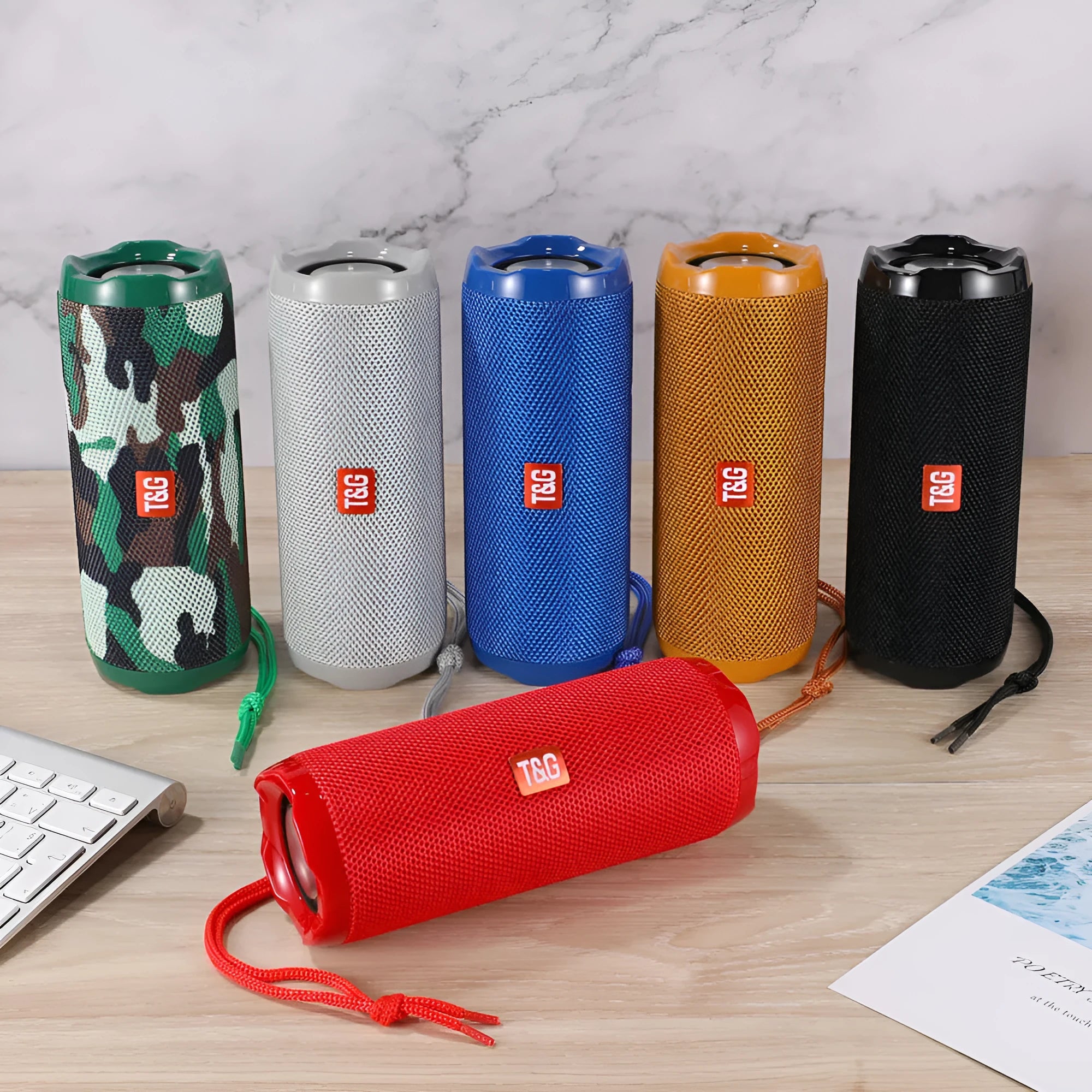 Fabric portable Bluetooth speaker with integrated card holder in one of six colour options.