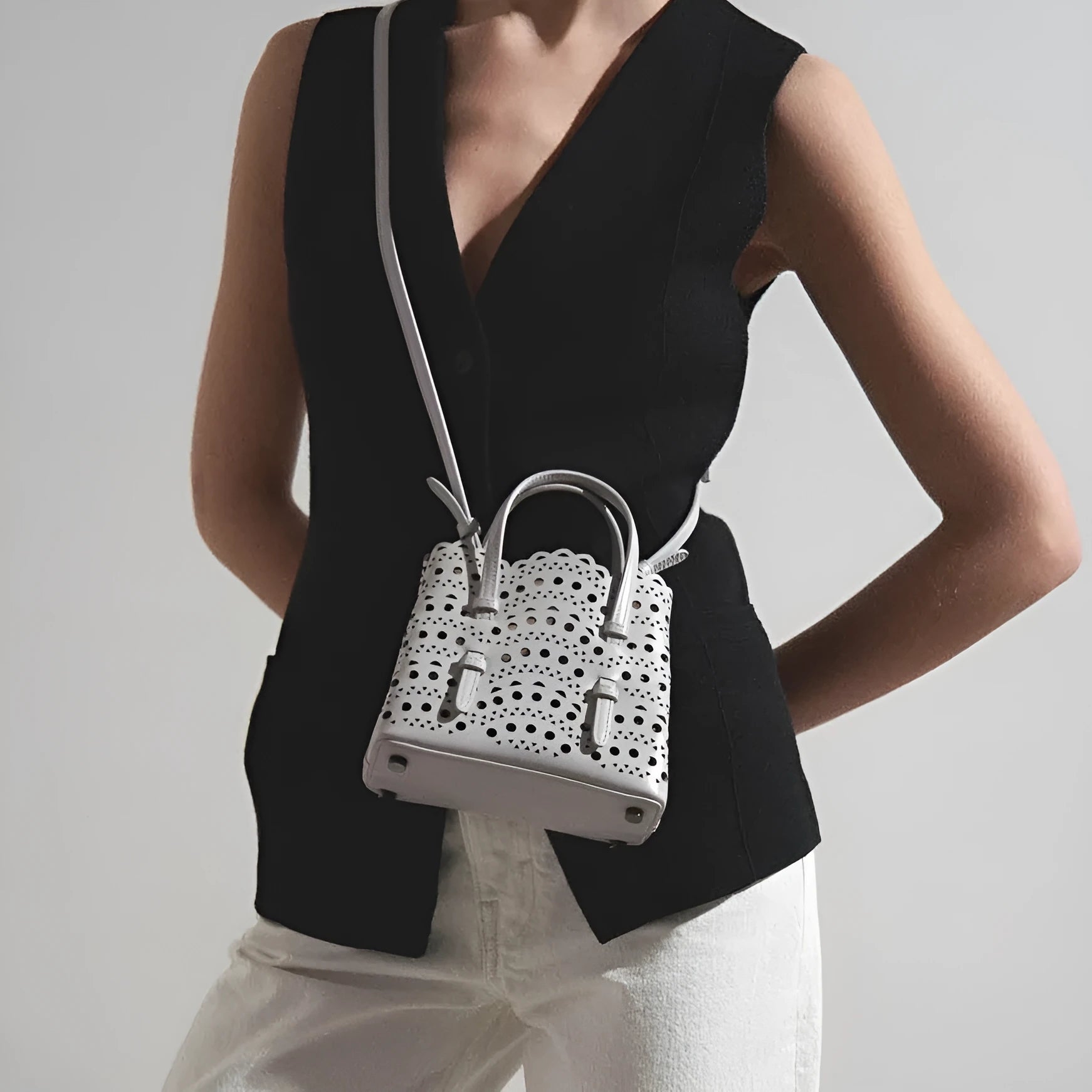 Hollow carved PU leather messenger bag with three straps in horizontal square shape