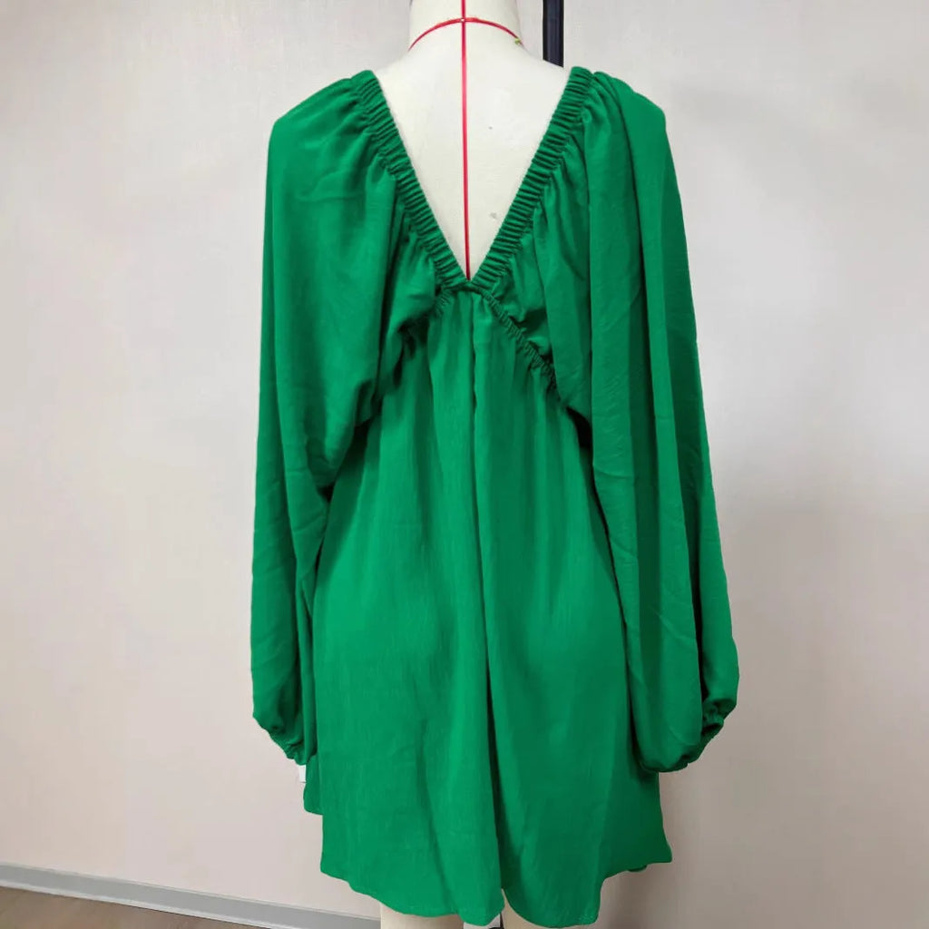 Women's apricot V-neck dress with puff sleeves and swing skirt design for office wear