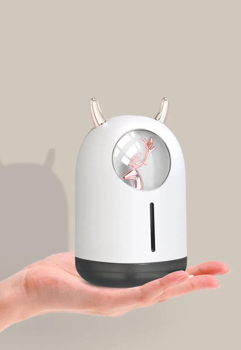 Mini animal-shaped USB aroma diffuser humidifier in white or pink with single mist outlet for small spaces