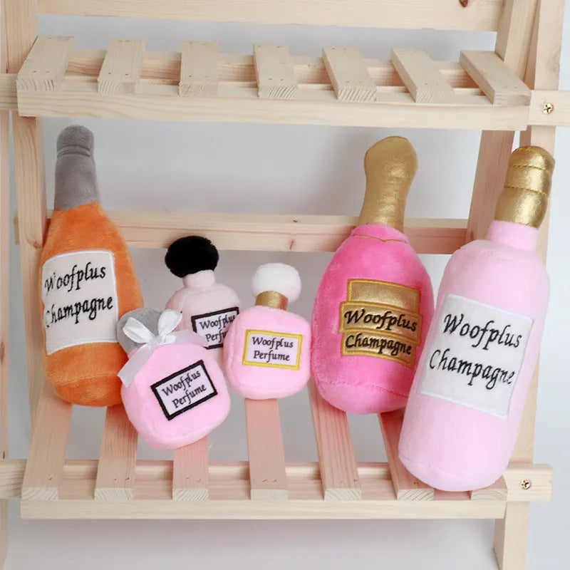 Soft plush dog toy shaped like a colourful wine bottle for gentle chew play.